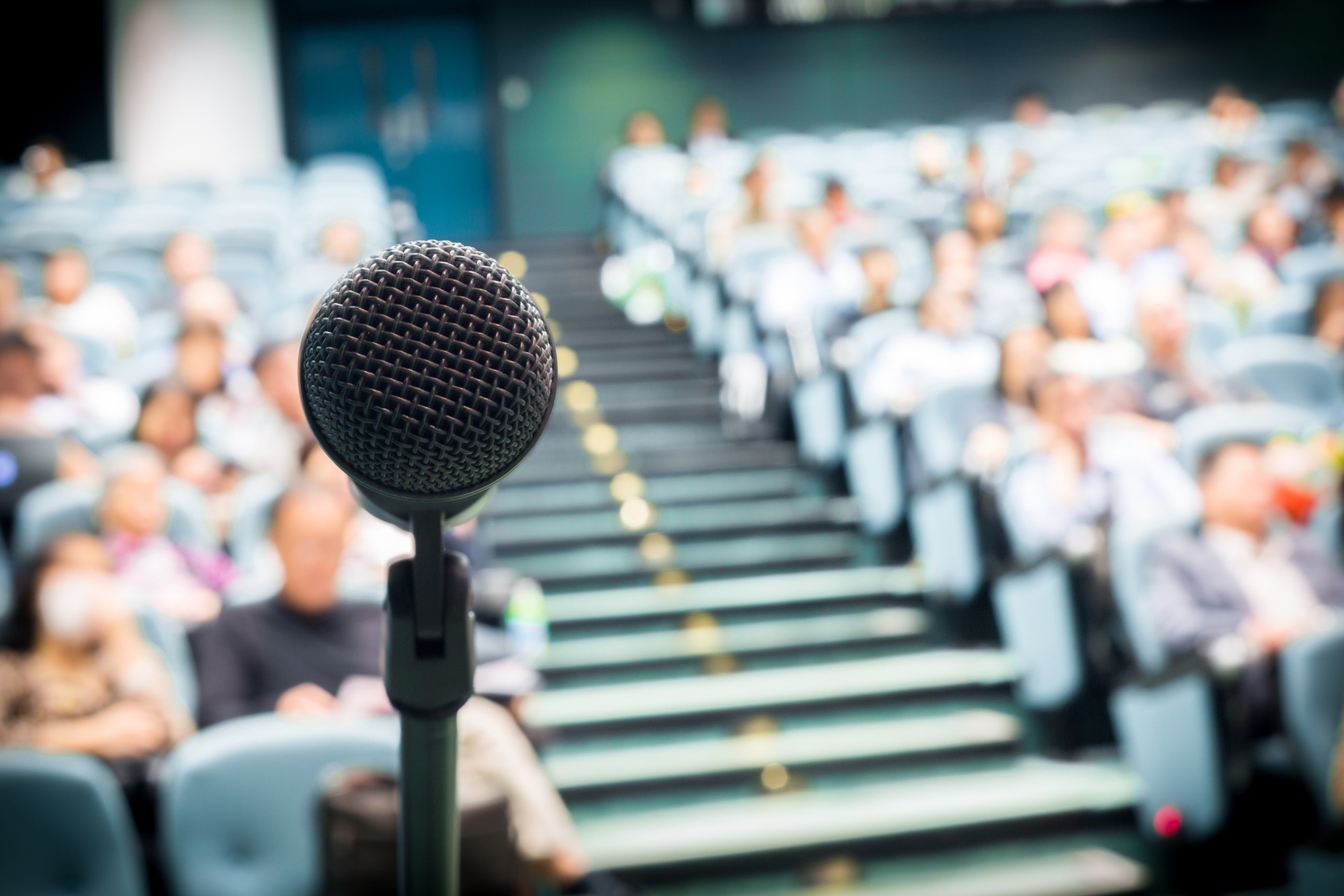 Microphone in front of audience of people