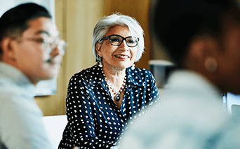 Woman smiling in business meeting